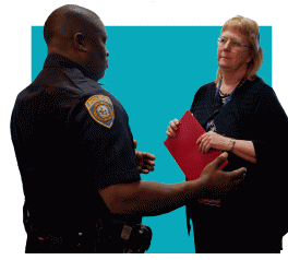 cop talks to school adminstrator 